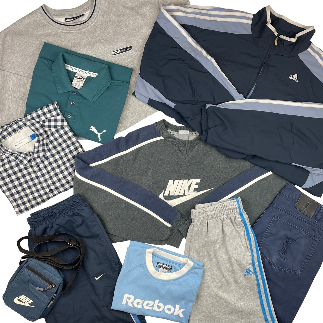 A collection of various branded clothing items including sweatshirts, hoodies, t-shirts, and tracksuit bottoms laid out on a white background.